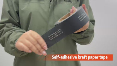 Close-up of custom black packaging tape with gold logo design featuring chef's hat and 